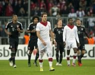 Lille's Nolan Roux (C) looks up at the scoreboard during their match against Bayern Munich